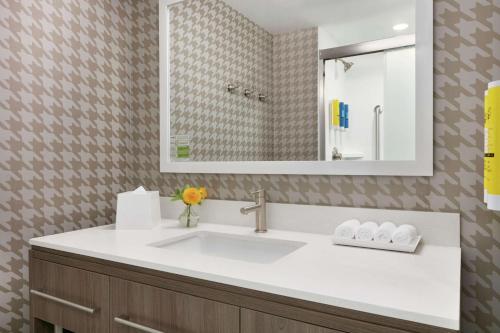 a bathroom with a sink and a mirror at Home2 Suites By Hilton Easton in Easton