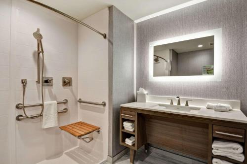 a bathroom with a sink and a shower at Home2 Suites By Hilton Jacksonville South St Johns Town Ctr in Jacksonville
