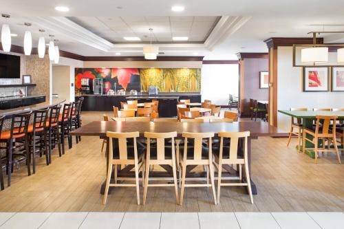a dining room with a large table and chairs at Fairfield Inn & Suites by Marriott Toronto Airport in Mississauga