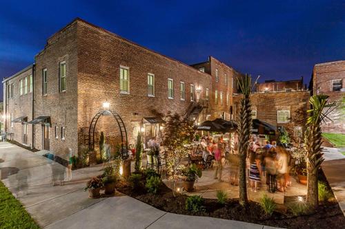 a group of people standing outside of a brick building at Hotel Florence, Tapestry Collection by Hilton in Florence