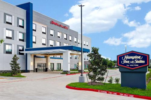 a hotel with a sign in front of it at Hampton Inn & Suites Houston East Beltway 8, Tx in Houston