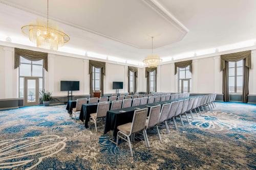 a large room with chairs and tables in it at Hotel Elkhart, Tapestry Collection By Hilton in Elkhart