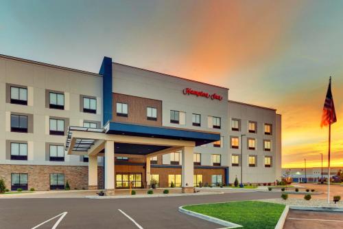 a rendering of a hotel with a sunset in the background at Hampton Inn Lebanon, IN in Lebanon