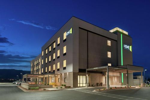 a hotel building with a sign on the side of it at Home2 Suites By Hilton Alamogordo White Sands in Alamogordo