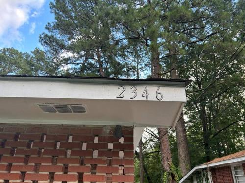 a house with a number on the top of it at Home Away From Home in Columbia
