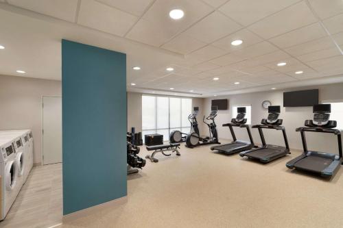 a gym with several treadmills and elliptical machines at Home2 Suites By Hilton Alamogordo White Sands in Alamogordo