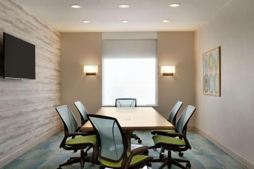 a conference room with a table and chairs at Home2 Suites By Hilton Alamogordo White Sands in Alamogordo