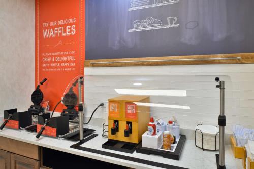 a table with a model of a kitchen on a counter at Hampton Inn & Suites Greensboro Downtown, Nc in Greensboro