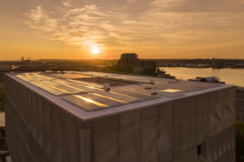 a roof of a building with the sunset in the background at Hotel Marcel New Haven, Tapestry Collection By Hilton in New Haven