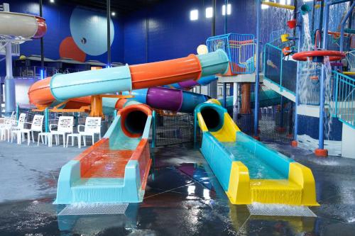 a playground with two slides in a room at Hampton Inn West Wichita Goddard in Goddard