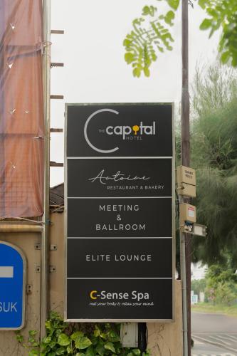 a sign for a meeting and ballroom on a street at The Capital Hotel Surabaya in Surabaya