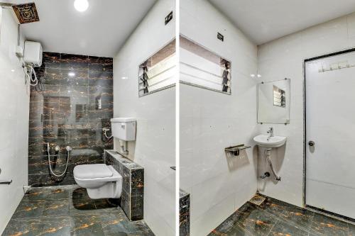 a bathroom with a toilet and a sink at Hotel O Maple view in Naroda