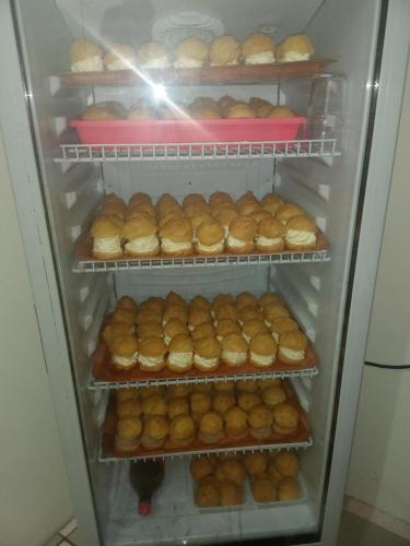 a refrigerator filled with lots of donuts at Nuutea lodge 2 in Avatoru