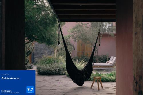 a black hammock hanging in a courtyard at Quinta Amores alojamiento in San Miguel de Allende
