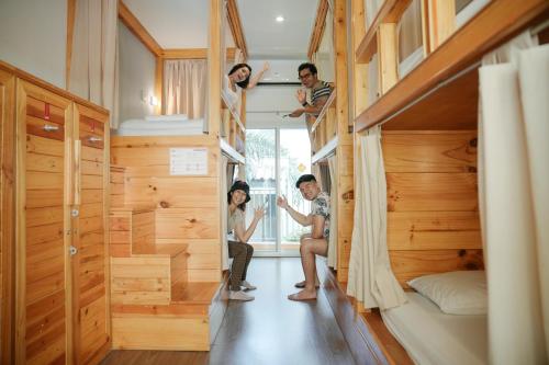 a group of people in a tiny house at Nonnee Hotel Kata Beach Phuket in Kata Beach