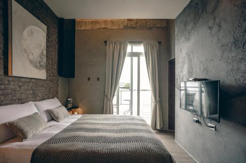 a bedroom with a large bed and a window at Original House in Chishang