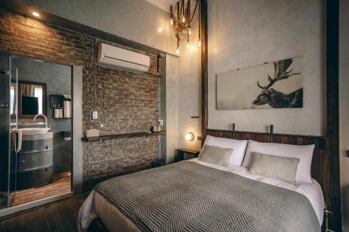 a bedroom with a bed with a deer on the wall at Original House in Chishang