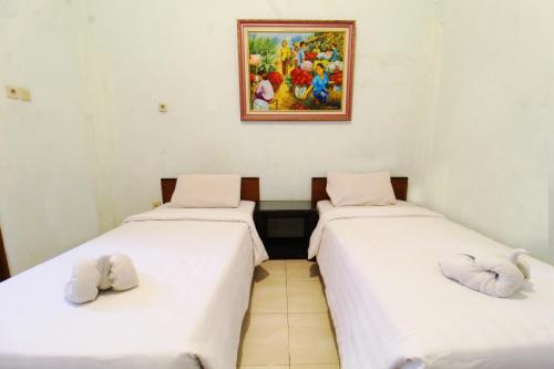 Sinergi Hotel Tretesにあるベッド