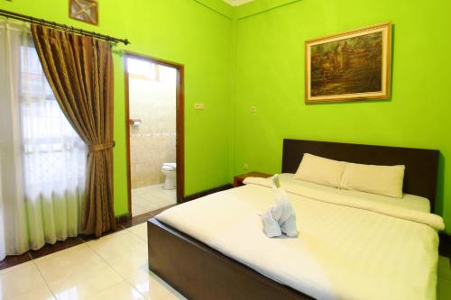 Sinergi Hotel Tretesにあるベッド
