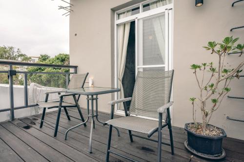 a patio table and chairs on a balcony at Original House in Chishang