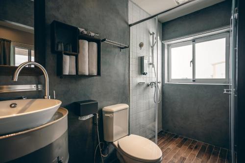a bathroom with a toilet and a sink at Original House in Chishang
