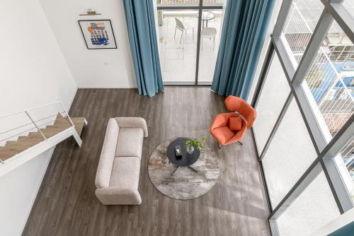 an overhead view of a living room with a couch and a table at M Village Living Kỳ Đồng in Ho Chi Minh City