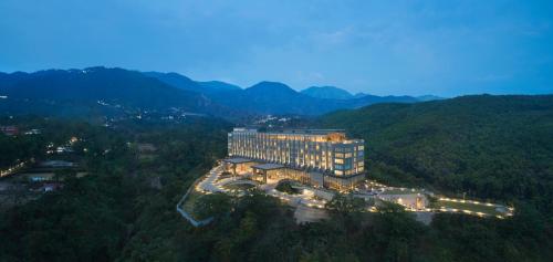 an aerial view of a hotel in the mountains at Hyatt Regency Dehradun Resort and Spa in Dehradun
