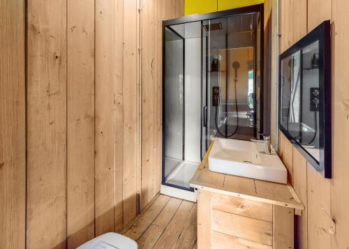 a bathroom with a sink and a mirror at Ladram Bay Holiday Park in Otterton