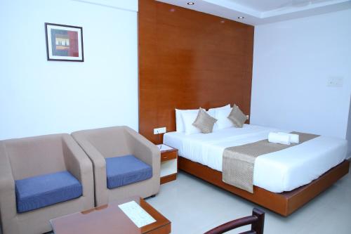 Ein Bett oder Betten in einem Zimmer der Unterkunft Nakshatra Emerald