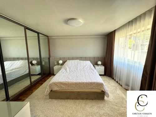 Postel nebo postele na pokoji v ubytování Chil'ux Chalets