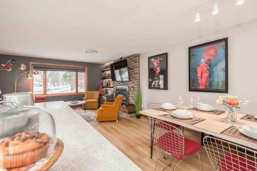 a kitchen and living room with a table and chairs at Brick House in Sioux Falls