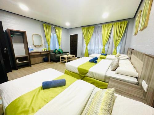 Ein Bett oder Betten in einem Zimmer der Unterkunft Salang Indah Tioman