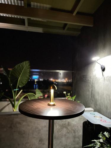 a table with a candle sitting on top of it at Distrikt 9 in Palakkad