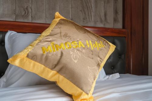 a blanket that is on top of a bed at MIMOSA HOTEL in Ha Long