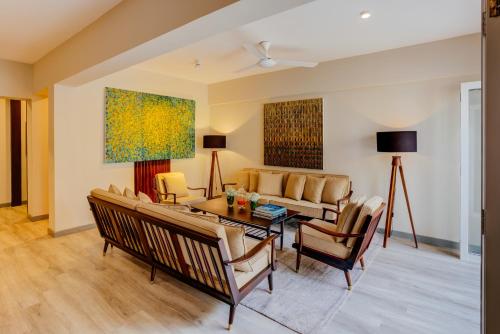 a living room with a couch and a table at Nyne Hotels - Lake Lodge, Colombo in Colombo