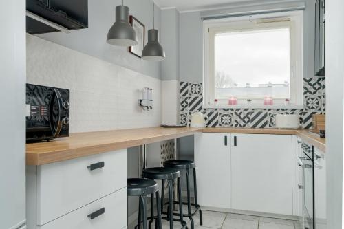 Kuchyňa alebo kuchynka v ubytovaní Family Apartments Osiedle Rusa by Renters