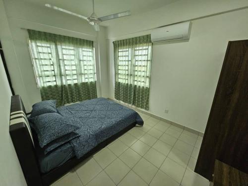 Katil atau katil-katil dalam bilik di A&H Homestay Seberang Jaya with Swimming Pool