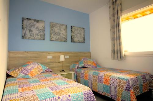 A bed or beds in a room at Global Immo 2166 ROCMAR