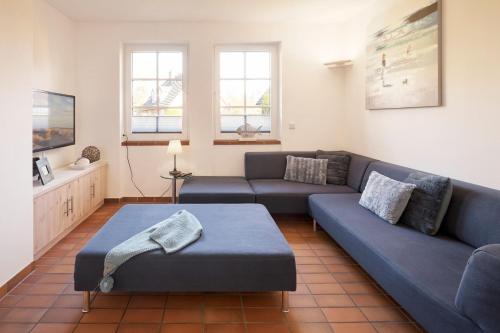 a living room with a couch and a table at Family&Friends in Wyk auf Föhr