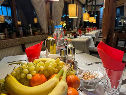 a table with a bunch of bananas and fruit on it at Family Hotel Eterno in Tsigov Chark
