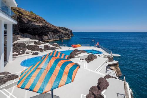 a view of the ocean from a resort pool at Sentido Galomar - Adults Only in Caniço