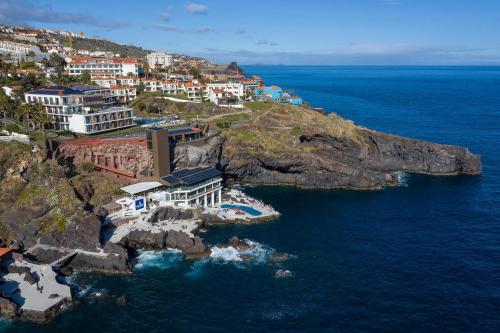 an aerial view of a village on a rocky island in the ocean at Sentido Galomar - Adults Only in Caniço