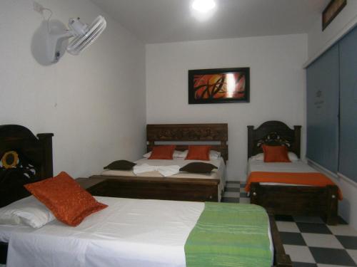 Postel nebo postele na pokoji v ubytování Hotel Shalom PHE Guaduas