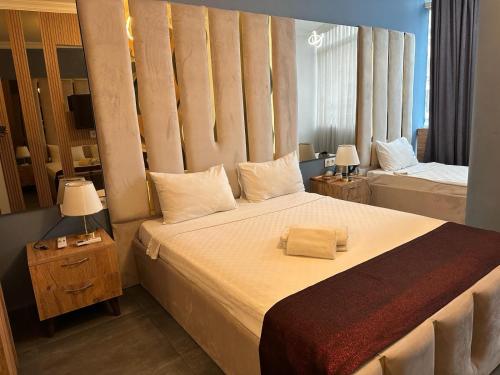Krevet ili kreveti u jedinici u okviru objekta Grand Niki Hotel & Spa
