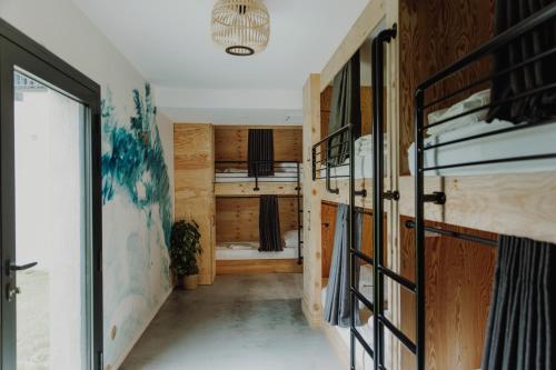 a room with bunk beds and a hallway at HEJMO in Hossegor