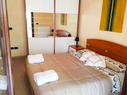 En eller flere senge i et værelse på Rosa Virginia Apartment