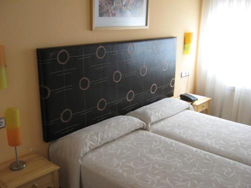 Cama o camas de una habitación en Hotel Puerta de Cazorla