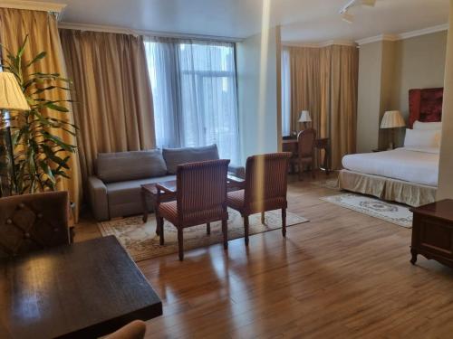 Ein Bett oder Betten in einem Zimmer der Unterkunft The Residence Hotel