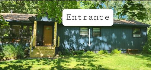 a house with a sign that reads entrance at Private Studio Close to Downtown Rhinebeck in Rhinebeck