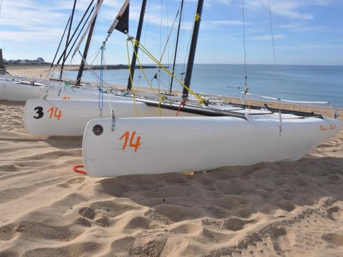 two boats sitting on the sand on the beach at Studio à Mesquer: Plage à 200m, Balcon, Parking, Proche Commerces - FR-1-306-1243 in Mesquer